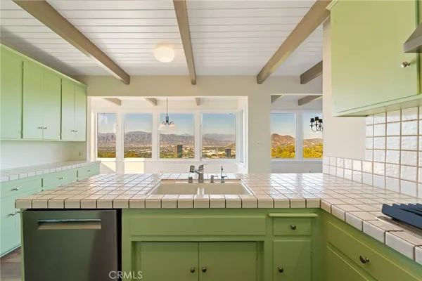 a kitchen with a sink and a window