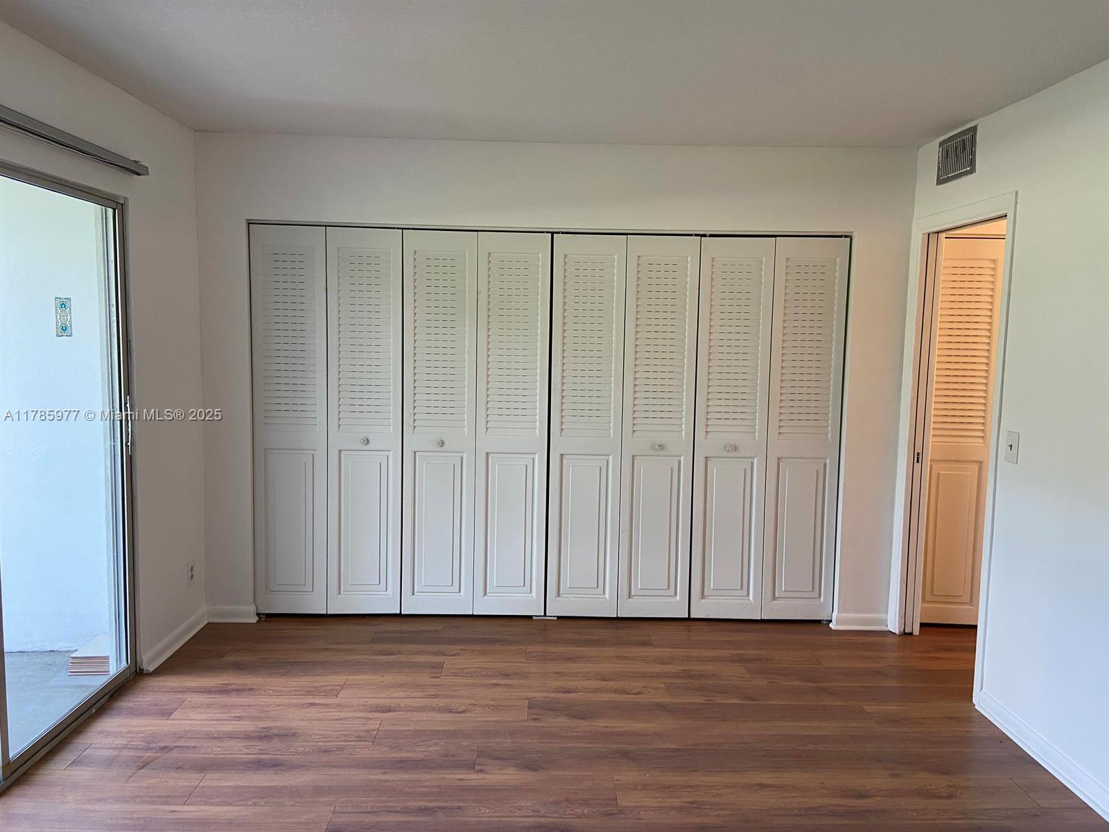 381 Fanshaw J, Unit 381 Boca Raton, FL 33434 - Photo 7 of 13 a view of wooden floor and entryway in a room