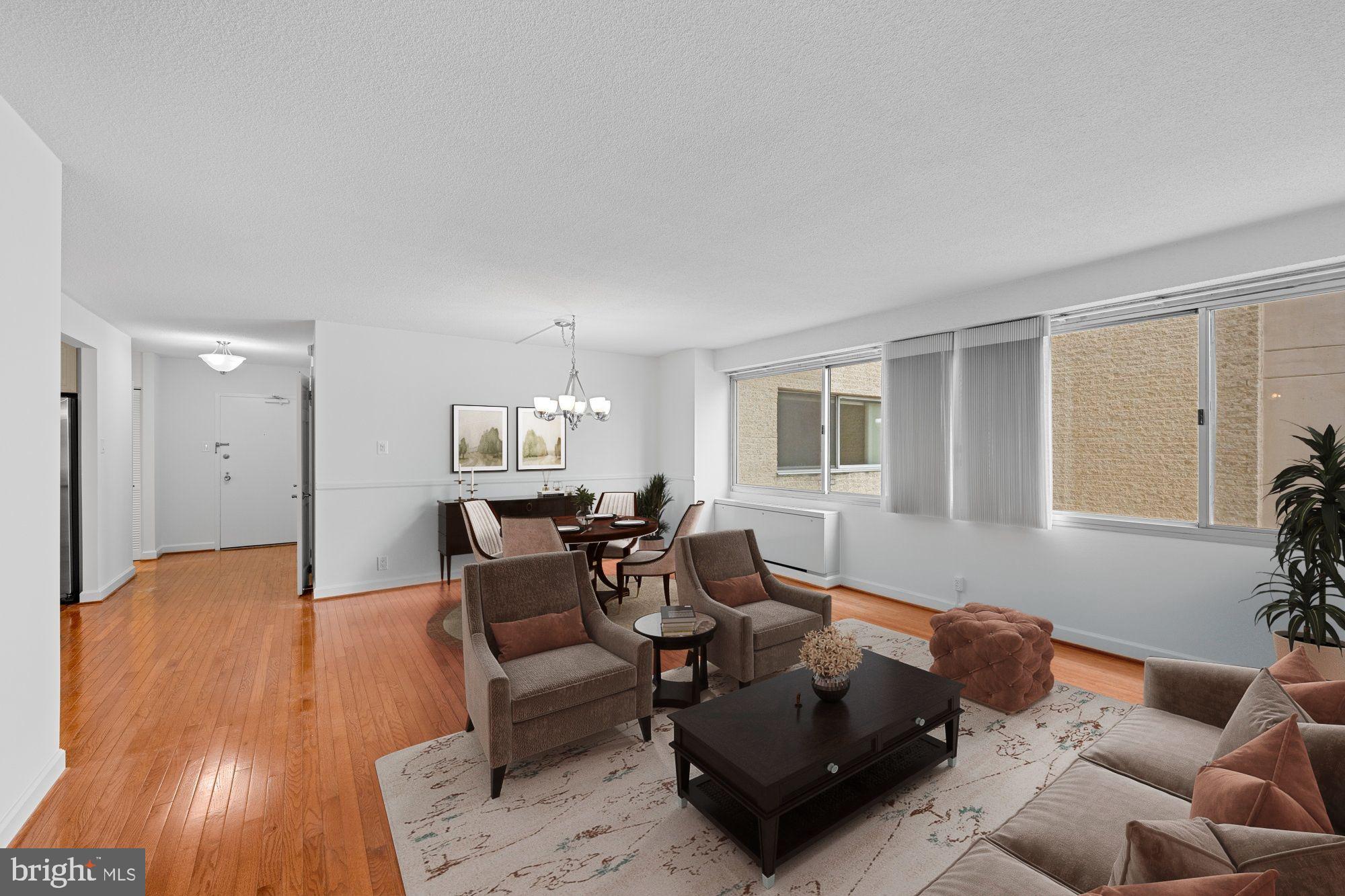 5500 Friendship Boulevard, Unit 2114N Chevy Chase, MD 20815 - Photo 6 of 19 a living room with furniture and wooden floor