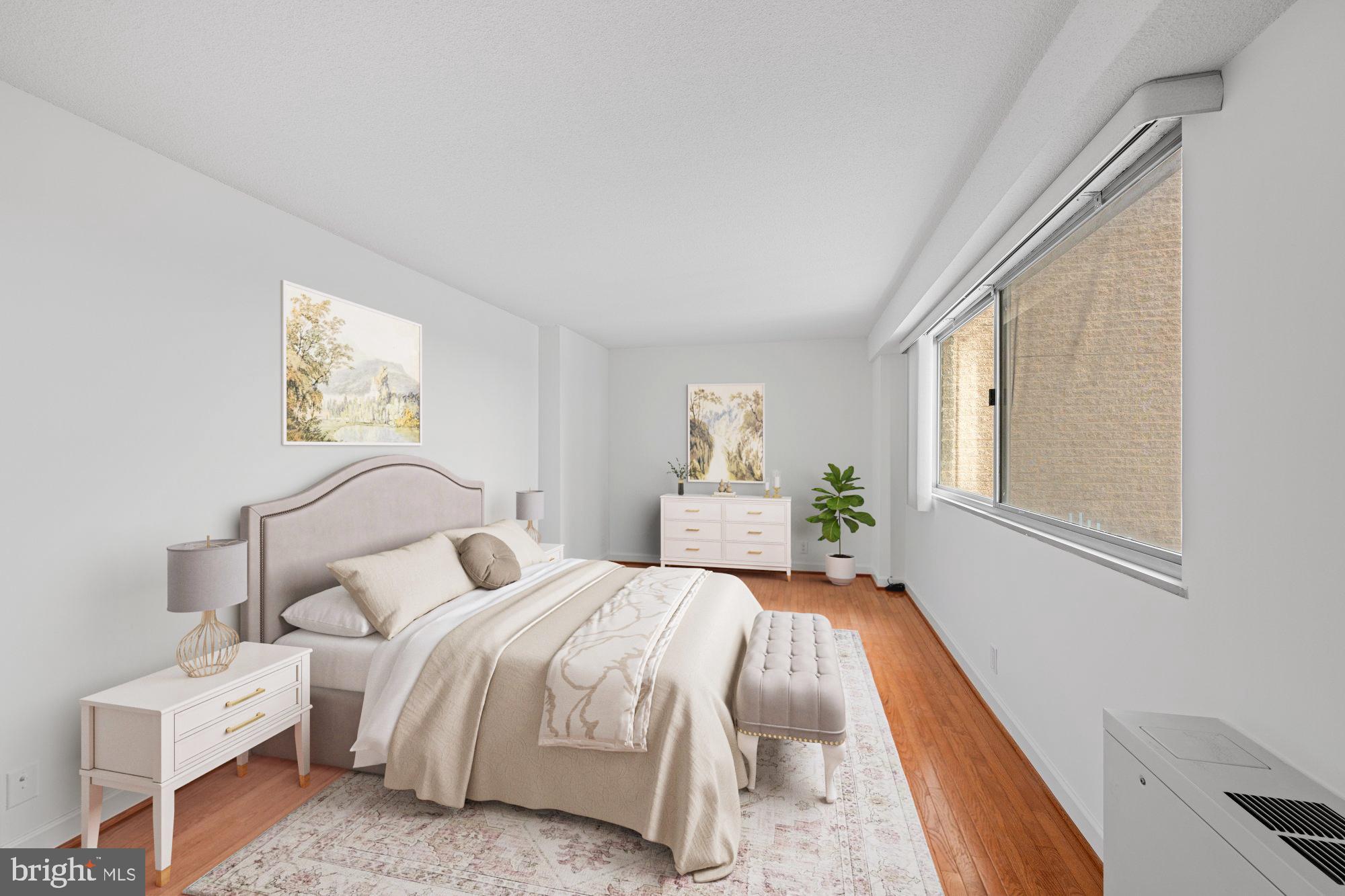 5500 Friendship Boulevard, Unit 2114N Chevy Chase, MD 20815 - Photo 9 of 19 a bed room with a bed and a window