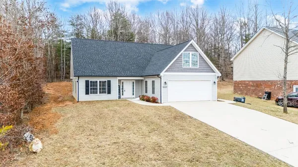 a house with trees in front of it