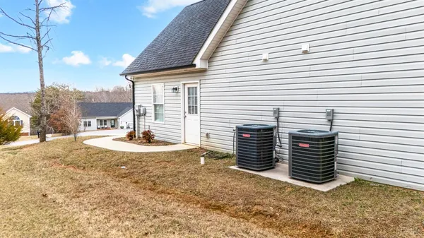 a view of a house with a yard and garage