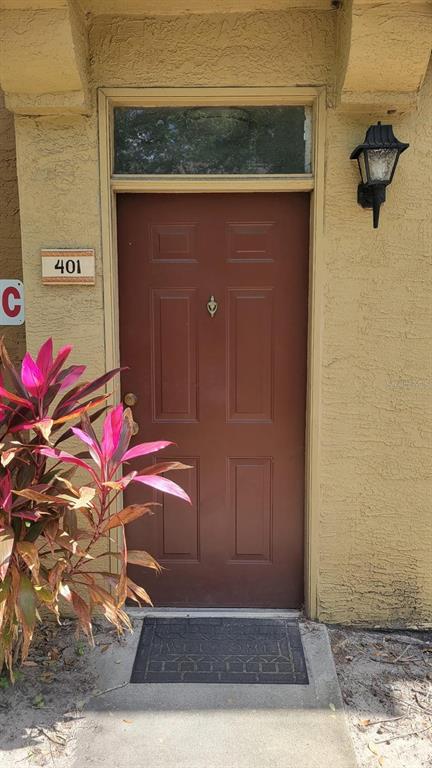 6316 Raleigh Street, Unit 401 Orlando, FL 32835 - Photo 2 of 6 a view of entryway