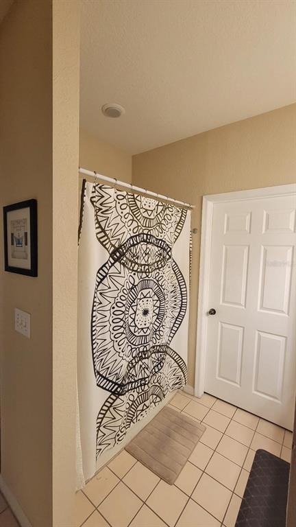 6316 Raleigh Street, Unit 401 Orlando, FL 32835 - Photo 6 of 6 a view of entryway with stairs