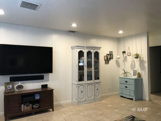 1237 West Iowa Avenue Ridgecrest, CA 93555 - Photo 9 of 20 a living room with furniture and a flat screen tv