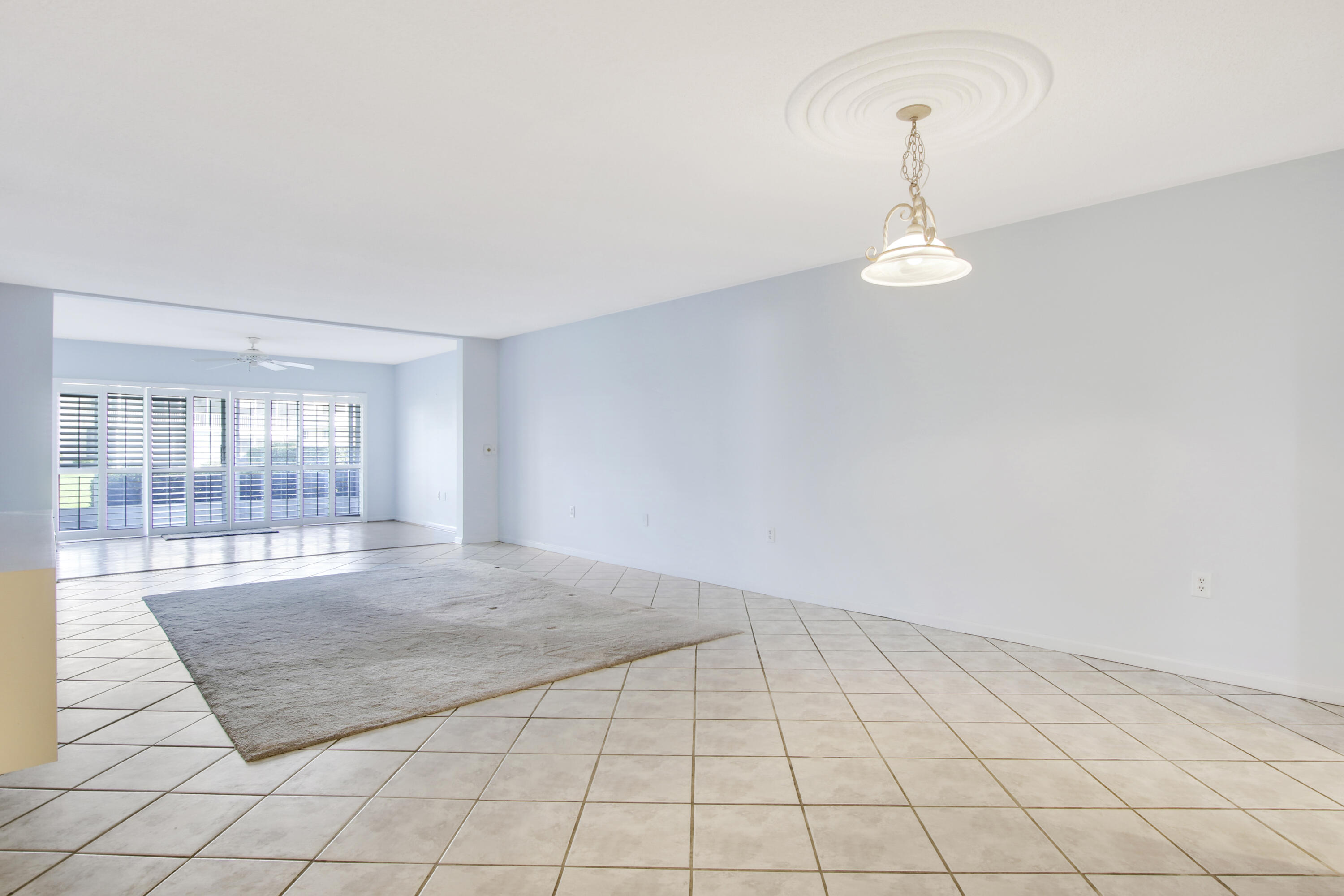 145 Atlantis Boulevard, Unit 105 Atlantis, FL 33462 - Photo 16 of 28 a view of an empty room and window