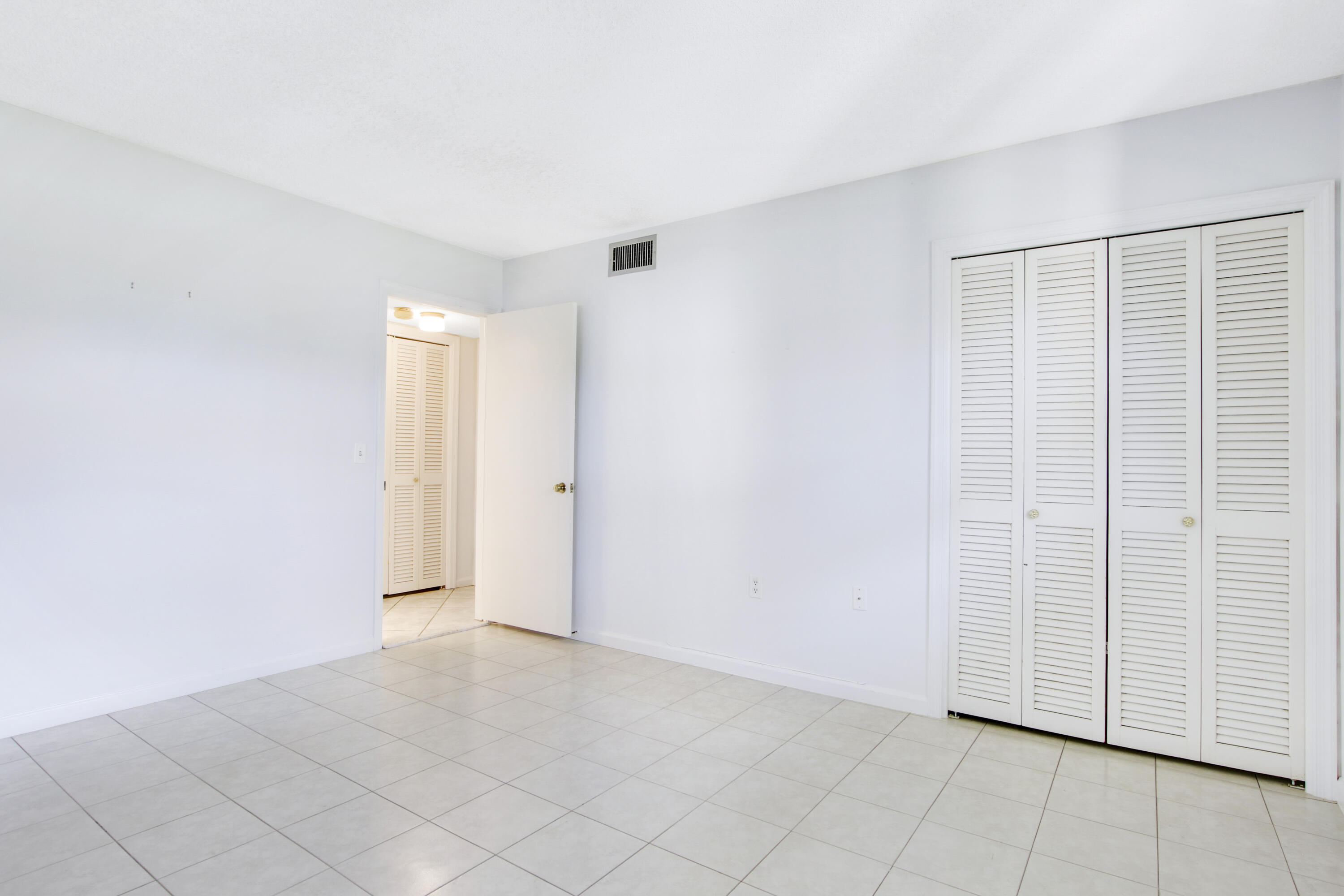 145 Atlantis Boulevard, Unit 105 Atlantis, FL 33462 - Photo 23 of 28 a view of an empty room
