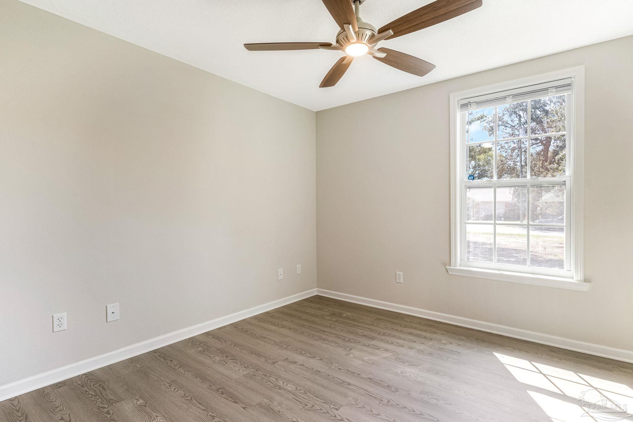 3152 Clemson Road Gulf Breeze, FL 32563 - Photo 18 of 56 an empty room with a window and a fan