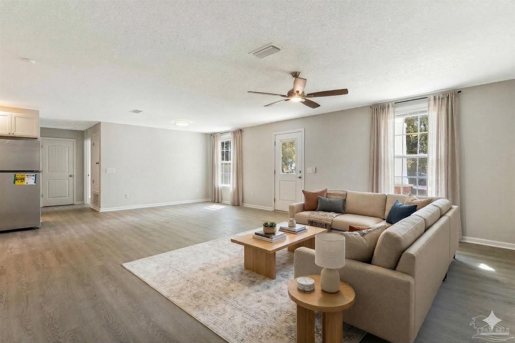 3152 Clemson Road Gulf Breeze, FL 32563 - Photo 2 of 56 a living room with furniture and a window