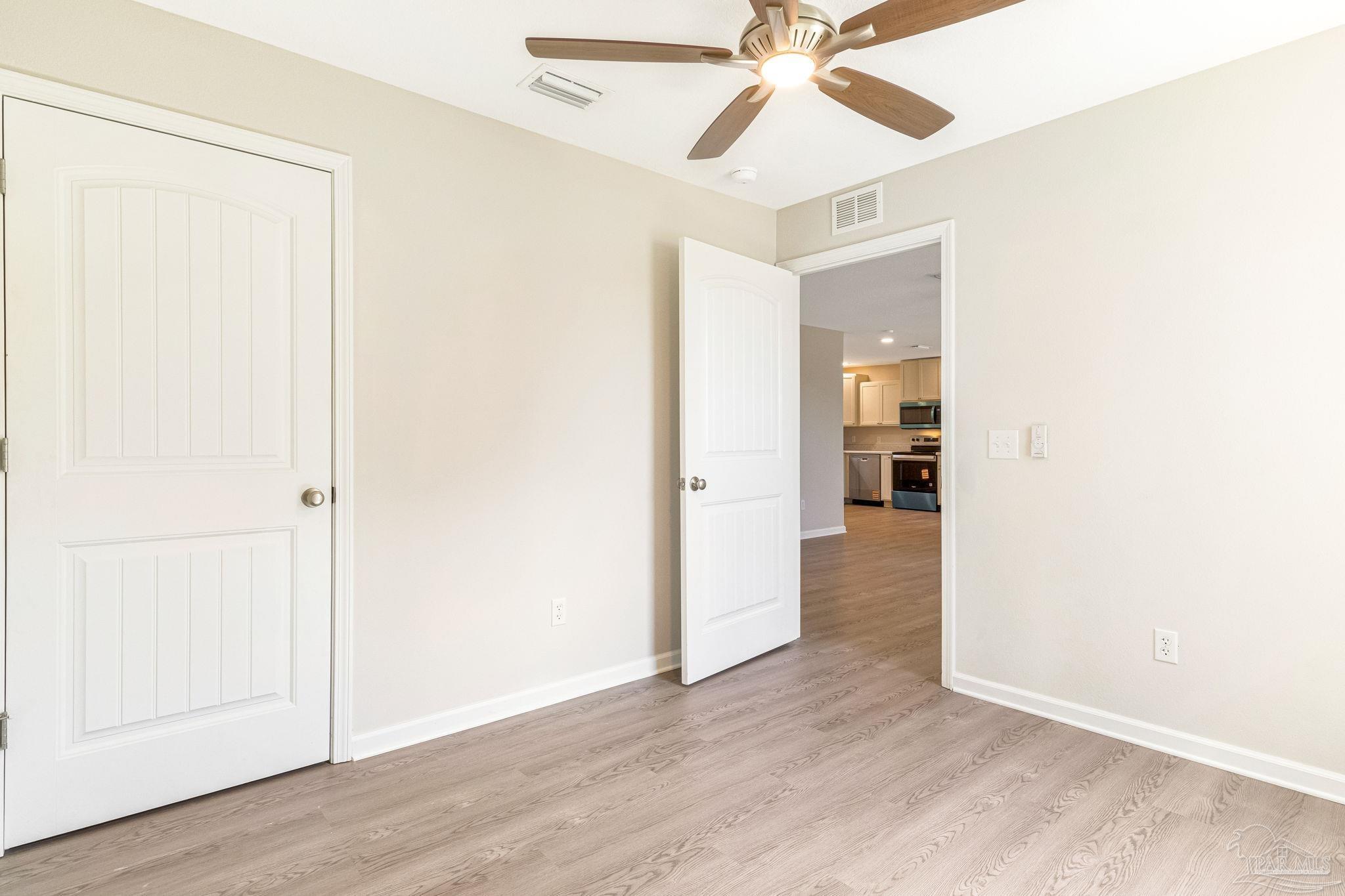 3152 Clemson Road Gulf Breeze, FL 32563 - Photo 32 of 56 a view of a hallway with wooden floor