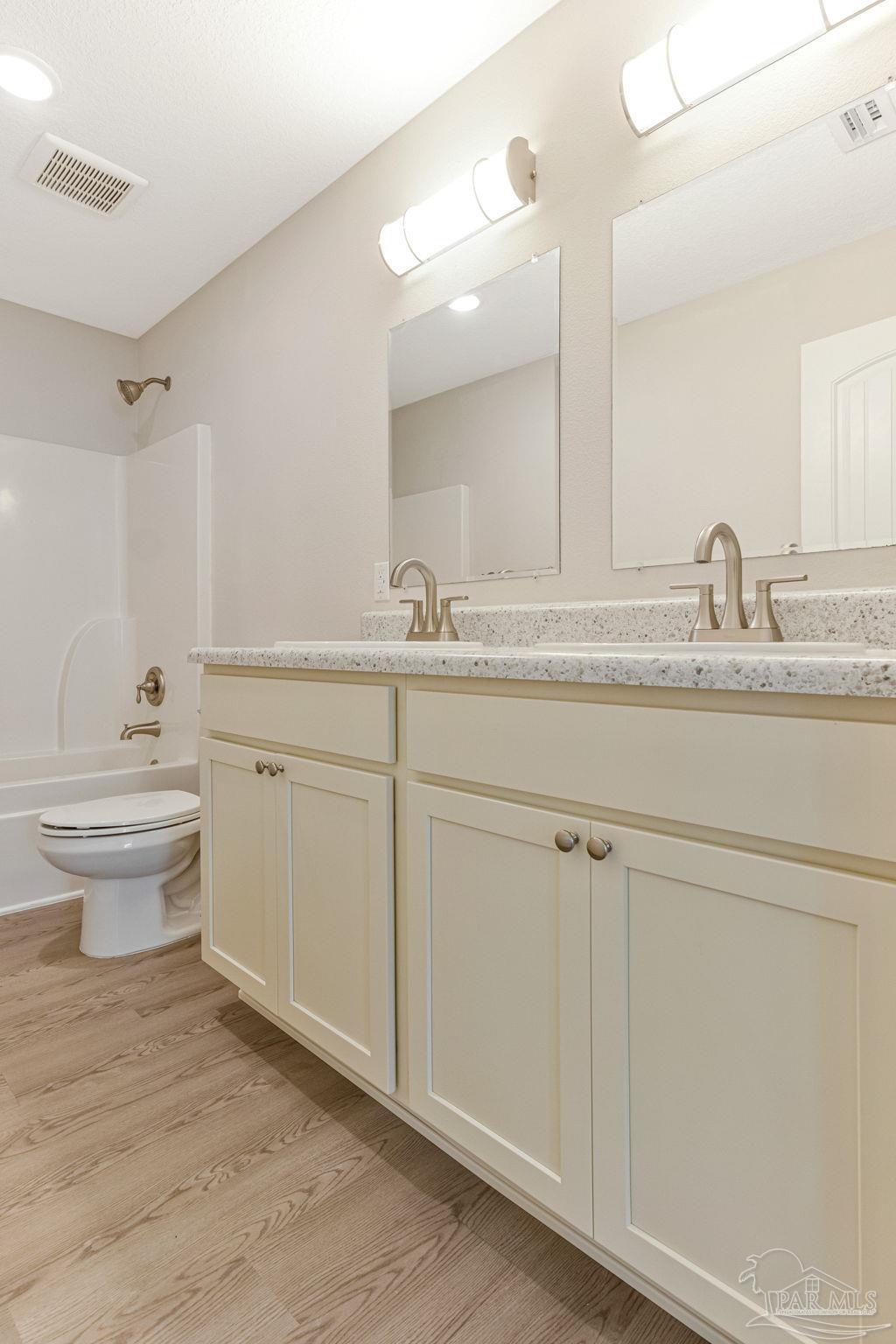 3152 Clemson Road Gulf Breeze, FL 32563 - Photo 35 of 56 a bathroom with a sink and a toilet