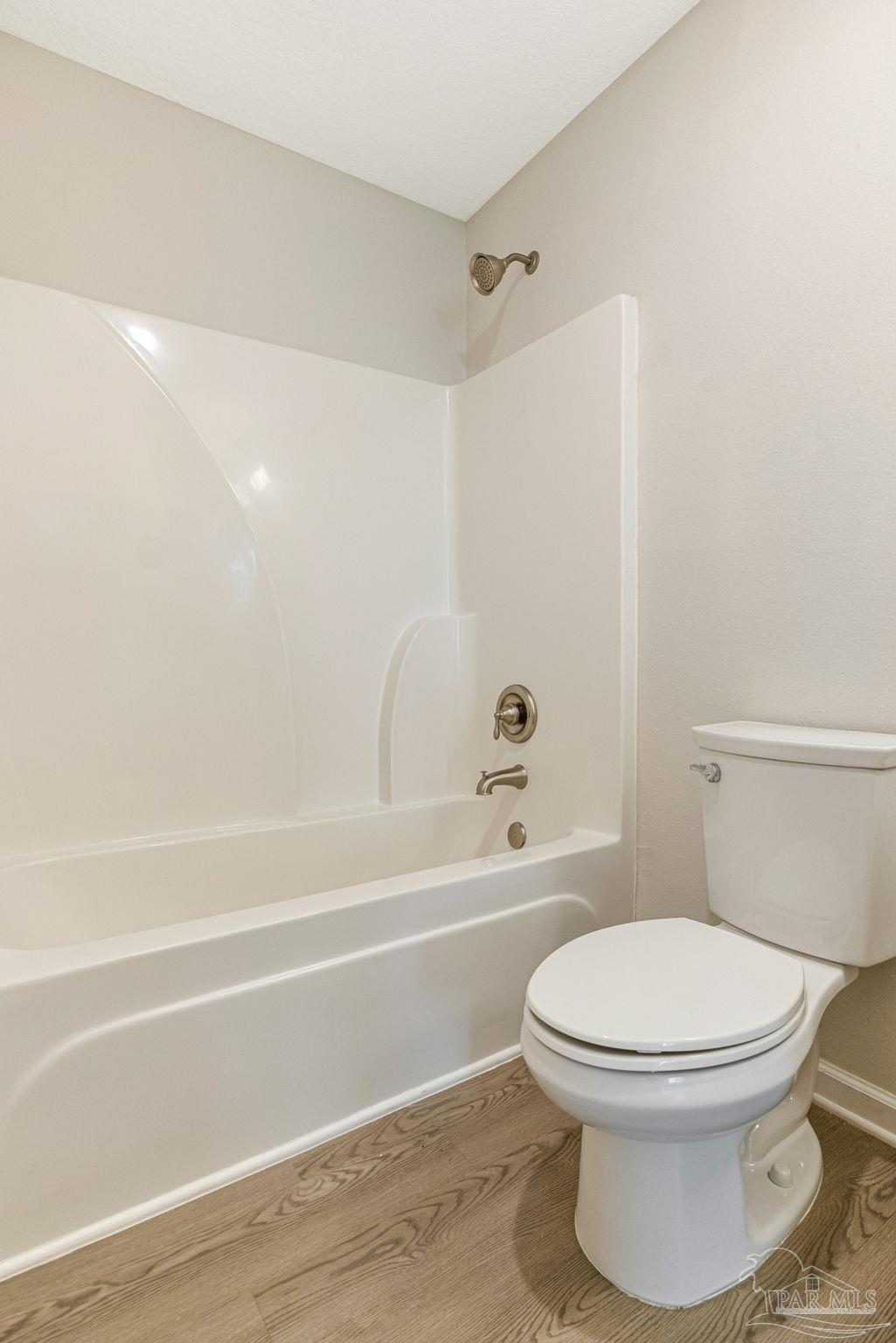 3152 Clemson Road Gulf Breeze, FL 32563 - Photo 36 of 56 a bathroom with a toilet and a bath tub