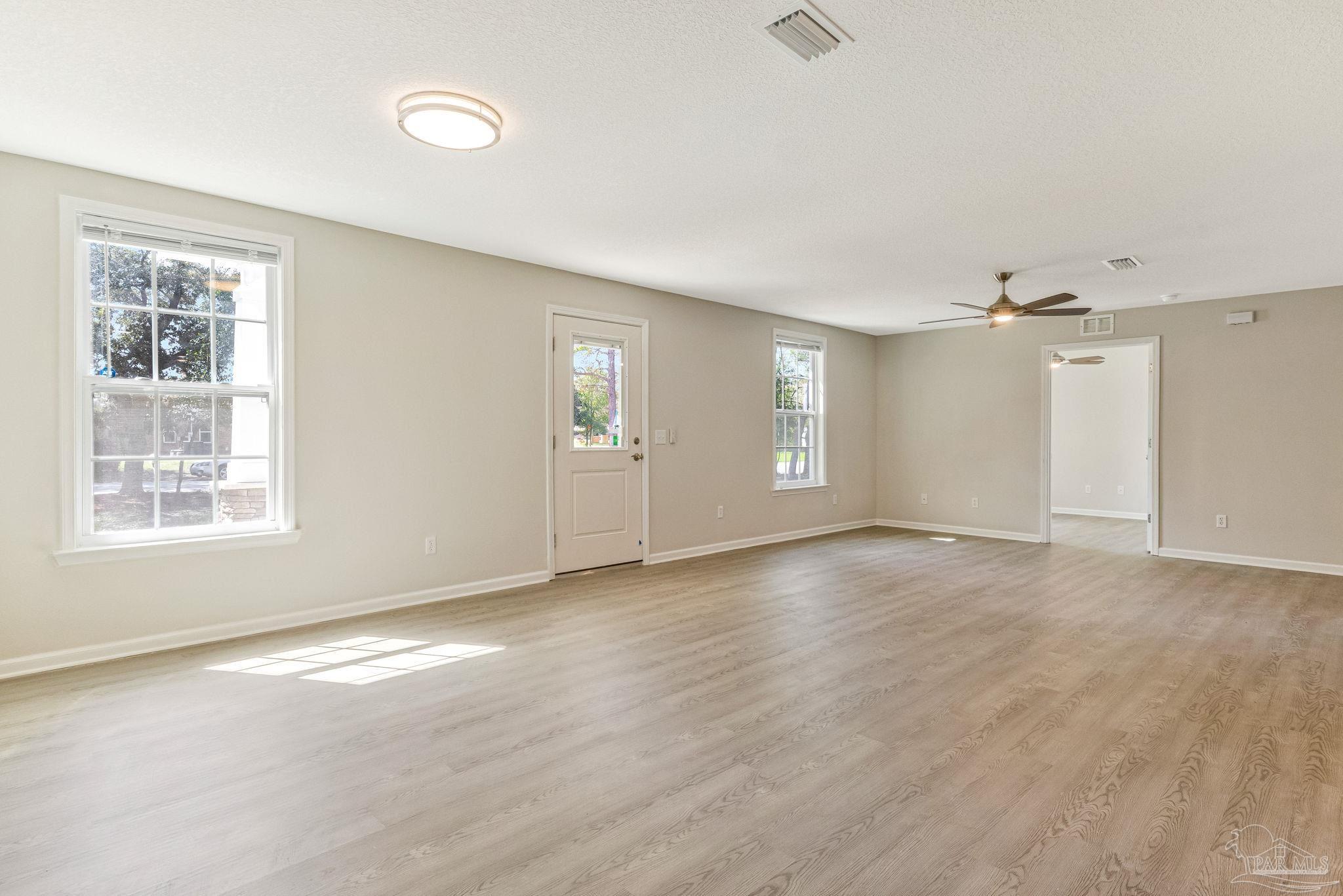 3152 Clemson Road Gulf Breeze, FL 32563 - Photo 10 of 56 an empty room with windows and closet