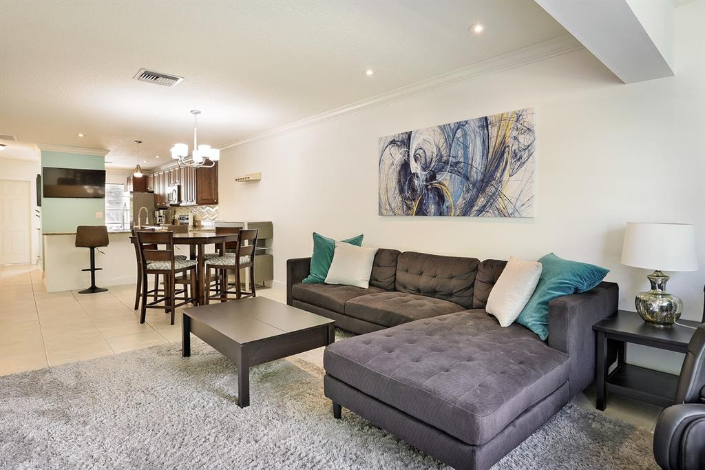 1141 Calamondin Terrace, Unit 202 Delray Beach, FL 33445 - Photo 8 of 19 a living room with furniture and kitchen view