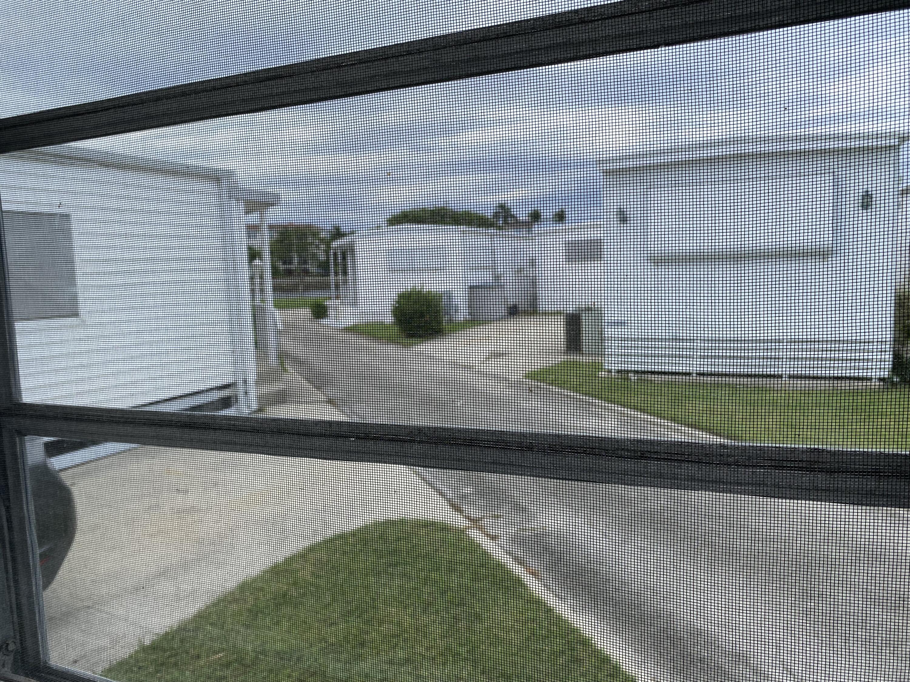 209 Java Drive, Unit J Briny Breezes, FL 33435 - Photo 2 of 11 a kitchen with kitchen island sink refrigerator and stove
