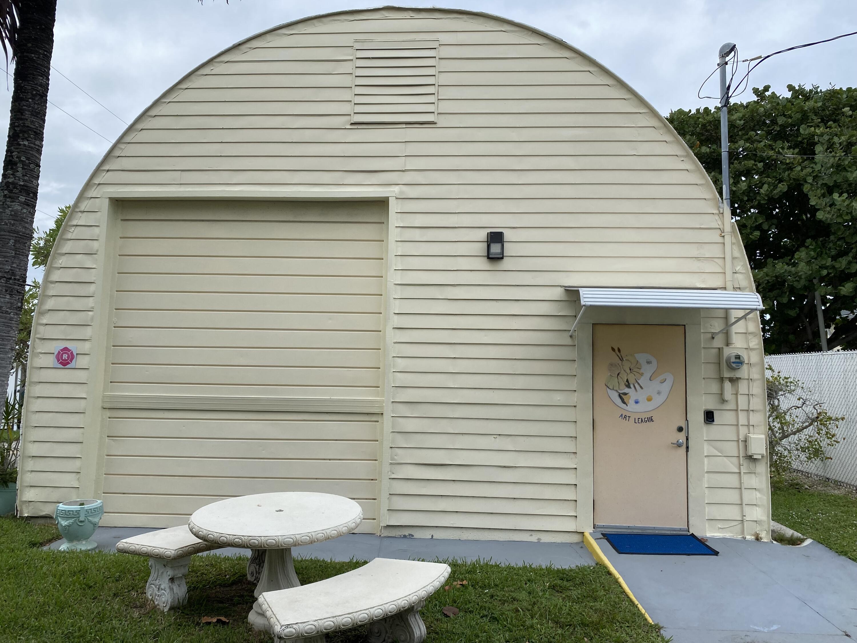209 Java Drive, Unit J Briny Breezes, FL 33435 - Photo 4 of 11 a view of a porch with seating space