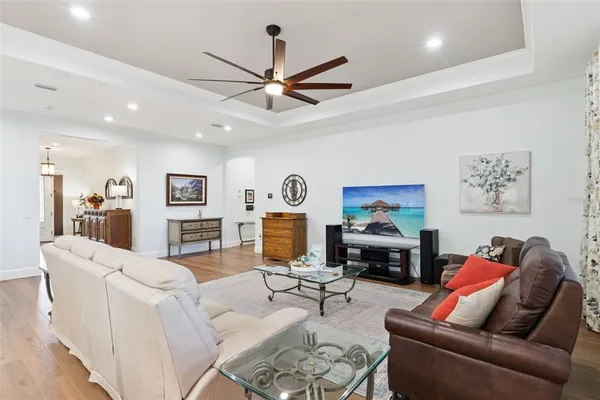 a kitchen with stainless steel appliances granite countertop lots of counter top space and wooden floor