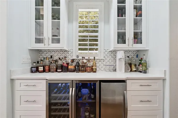 a stove top oven sitting inside of a kitchen