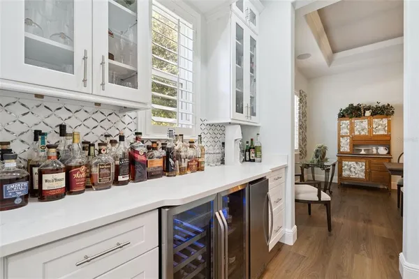 a large kitchen with a table and chairs