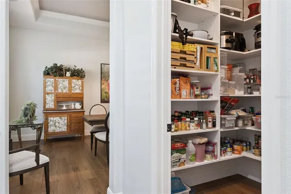 a kitchen with kitchen island a sink stove and refrigerator