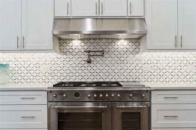 a living room with furniture and a book shelf