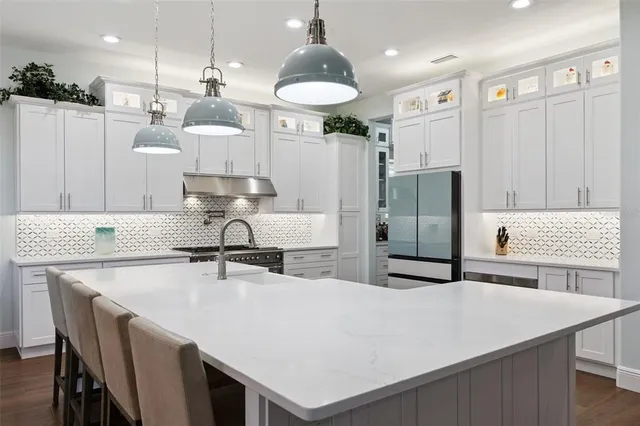 a view of a dining room and hall with furniture