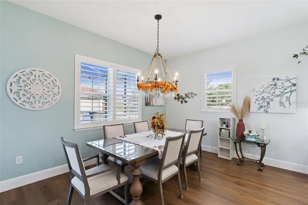 a dining room with furniture and window