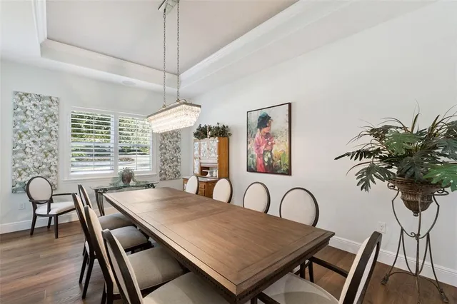 a bathroom with a granite countertop double vanity sink and a bathtub