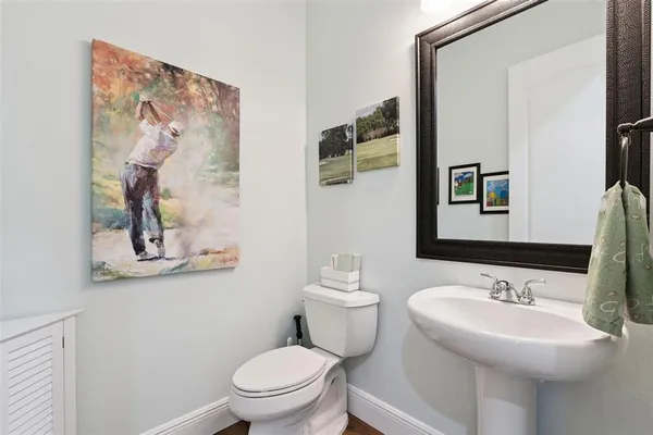 a view of a bathroom with a sink mirror and a bathtub
