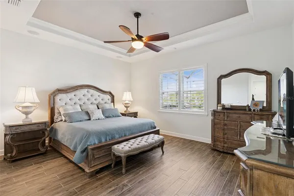 a bathroom with a granite countertop double vanity and a mirror