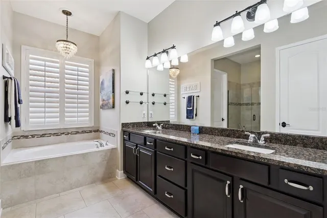 a utility room with sink dryer and washer
