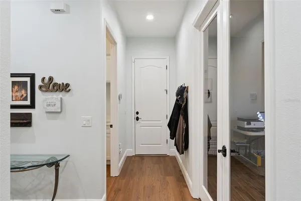a bathroom with a granite countertop sink a mirror a vanity and shower