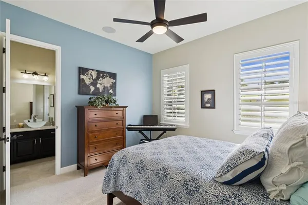 an aerial view of a house with a garden and lake view