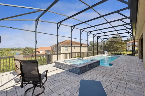 an aerial view of a houses with outdoor space and river