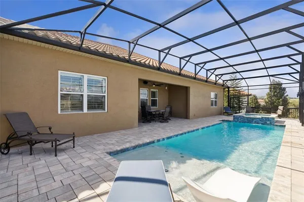 an aerial view of a house with outdoor space lake view and mountain view