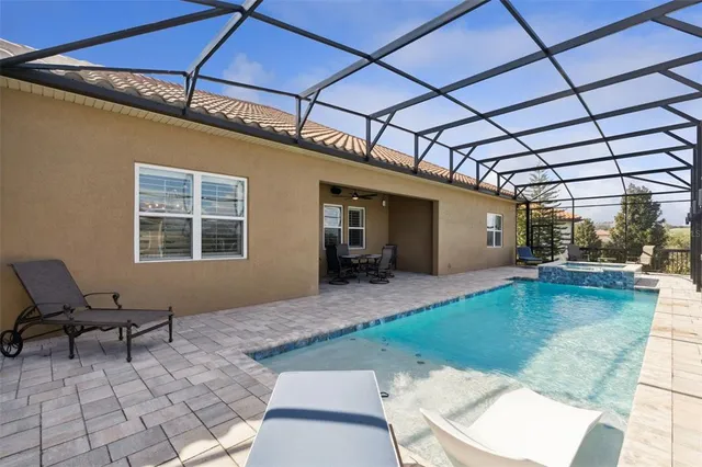 an aerial view of a house with outdoor space lake view and mountain view