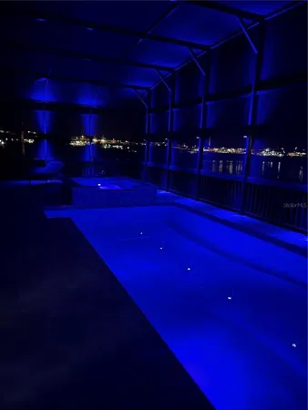 an aerial view of a houses with outdoor space and lake view