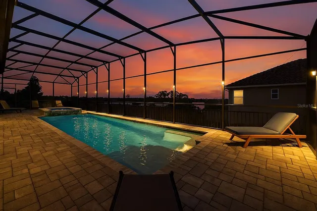 an aerial view of a houses with outdoor space and lake view