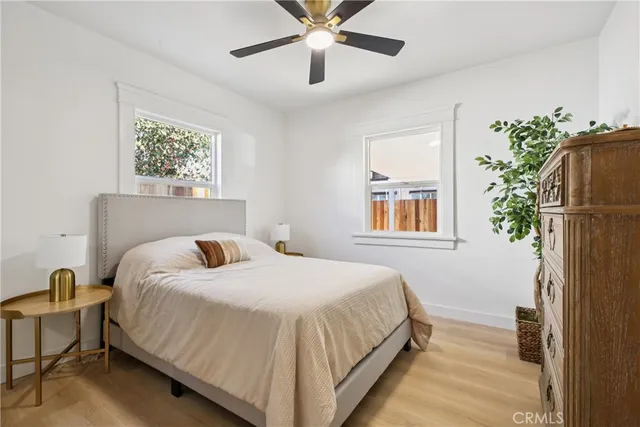 a bedroom with bed and window