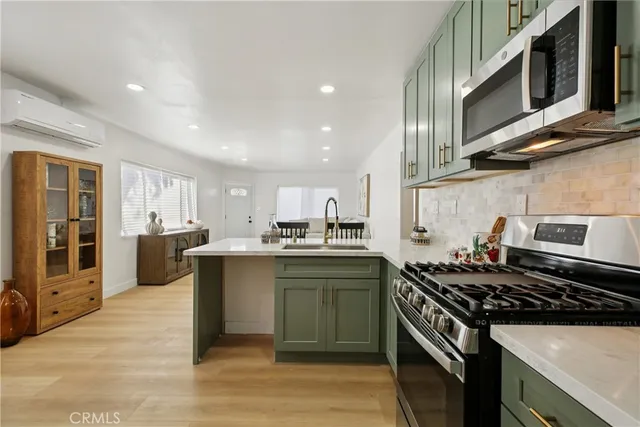 a kitchen with lots of counter top space and stove top oven