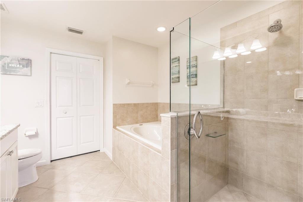 3071 Meandering Way, Unit 101 Fort Myers, FL 33905 - Photo 21 of 49 a bathroom with a shower and a tub