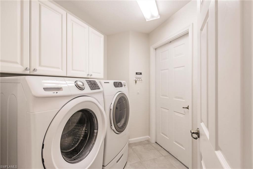 3071 Meandering Way, Unit 101 Fort Myers, FL 33905 - Photo 28 of 49 a utility room with dryer and washer