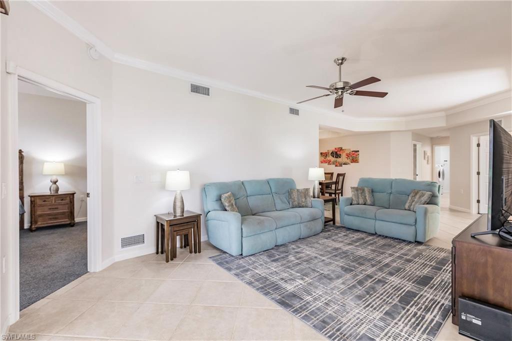 3071 Meandering Way, Unit 101 Fort Myers, FL 33905 - Photo 9 of 49 a living room with furniture and a ceiling fan