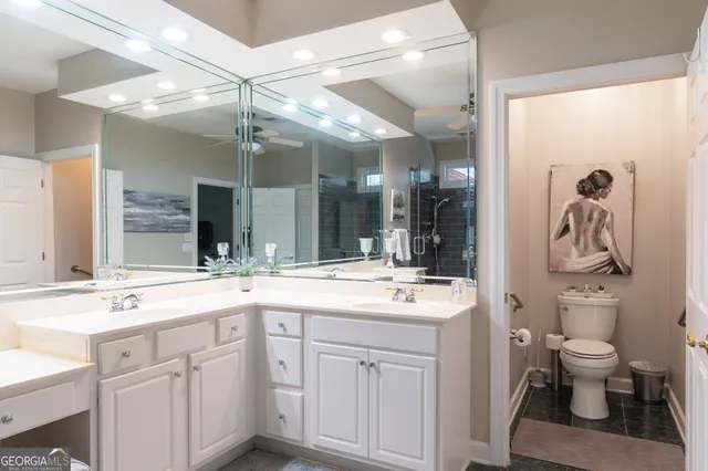 a spacious bathroom with a sink and a mirror