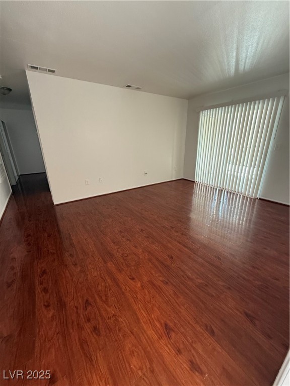 800 North Major Avenue Henderson, NV 89015 - Photo 3 of 18 Unfurnished room featuring dark wood-style floorin