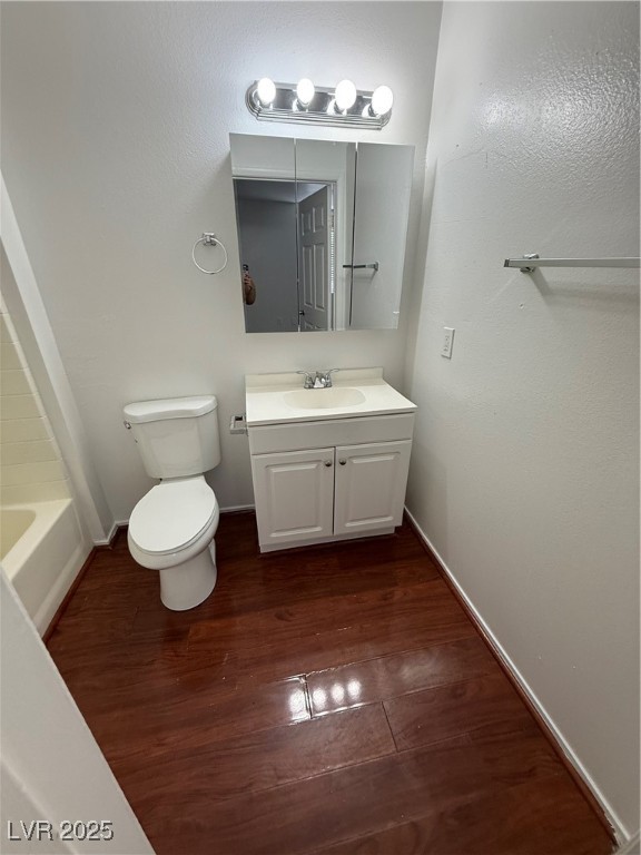 800 North Major Avenue Henderson, NV 89015 - Photo 7 of 18 Full bath with wood finished floors, vanity, a tub