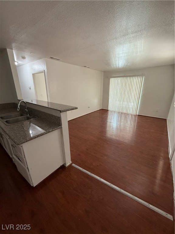 800 North Major Avenue Henderson, NV 89015 - Photo 8 of 18 Kitchen with dark wood-style flooring, a textured