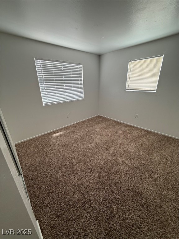 800 North Major Avenue Henderson, NV 89015 - Photo 9 of 18 Carpeted spare room featuring baseboards
