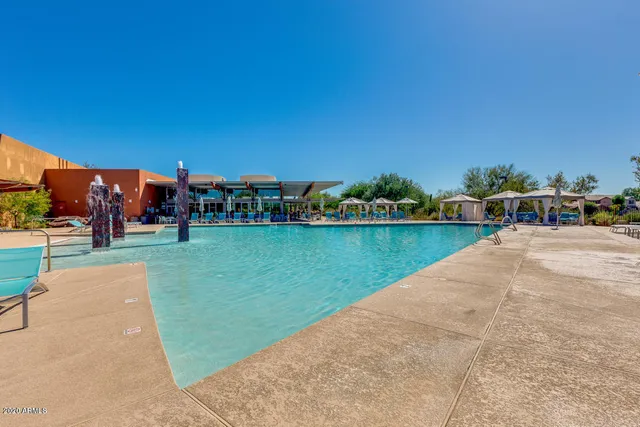 a view of a swimming pool and a yard