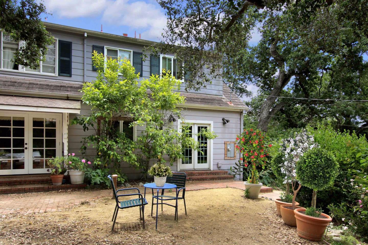 21 Oak Road Santa Cruz, CA 95060 - Photo 3 of 25 a view of a house with backyard sitting area and garden